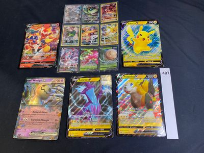 the pokemon cards are lined up on a black surface