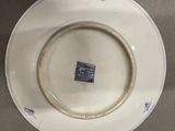 a plate with a blue and white design on it