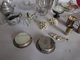 a table with a lot of silver items on it