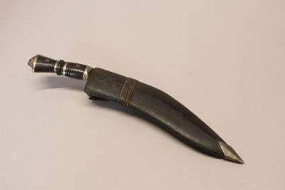 a knife that is laying on a table