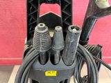 an image of a power washer with a bunch of hoses attached to it