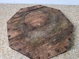 a large wooden object on the floor of a room