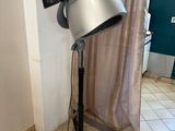 an image of a hair dryer on a stand in a room
