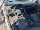 a car that is parked in a lot with its door open