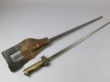 a pair of old tools sitting on top of a white table