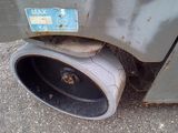 a close up of a car exhaust pipe with a sticker on it