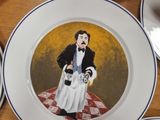 several plates with a painting of a man and a woman on them
