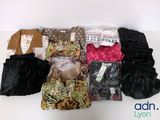 a lot of clothes that are sitting on a table