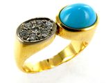 an image of a gold ring with a turquoise stone and black diamonds