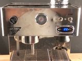 a coffee machine that is sitting on a wooden table