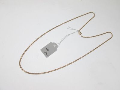 a close up of a gold chain with a price tag on it