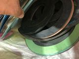 a person that is holding a stack of tape