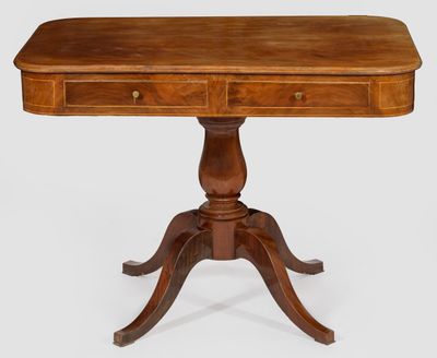 a wooden table with two drawers on top of it