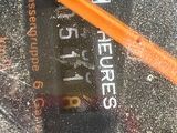 an orange pencil sitting on top of a piece of paper