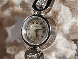 a close up of a watch on display on a table