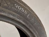 a close up of a tire on a white surface