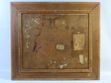une vieille photo d'un tableau dans un cadre en bois, sur lequel figure le portrait d'un homme