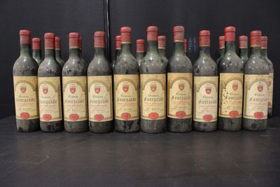 six bottles of wine are lined up in a row on a table
