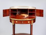 an image of a small table with a book on it