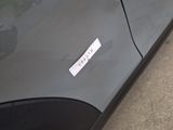 a sticker on the side of a car that has a sticker on it
