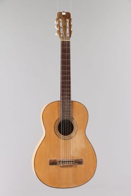 a close up of a guitar hanging from a string