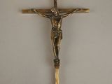 a gold crucif with a cross on it