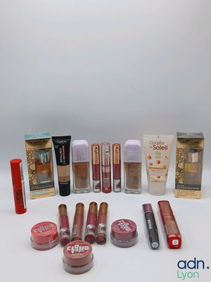 the contents of a variety of makeup products are arranged on a white surface