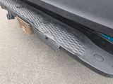 a close up of a black bumper on a black truck