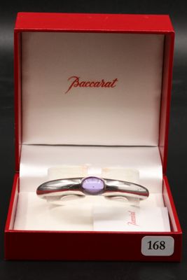 a close up of a ring in a red box on a table