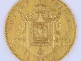 an image of a gold coin with a coat of arms on it