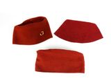 three pieces of red cloth with a gold ring on top