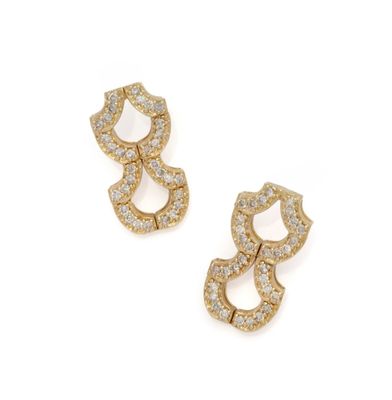 a pair of gold and diamond earrings on a white background