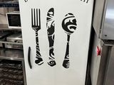 a refrigerator with a sign that says bon bon appetit on it