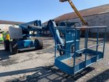 a blue scissor sitting in the middle of a parking lot