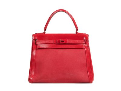 a red leather handbag on a white background