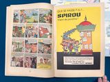 a person holding a comic book open to a page