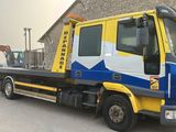 a truck that is parked in front of a building