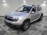 the silver dacia is parked in a room with a checkered floor
