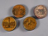 three small wooden boxes with pictures of people on them on a table