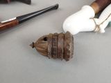 a pipe and a pipe holder sitting on a table