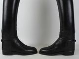 pair of black leather riding boots with buckles on each side