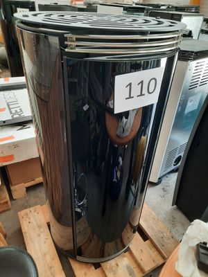 a large metal trash can sitting on a pallet in a warehouse