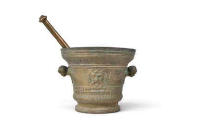 mortar with a wooden stick in it on a white background