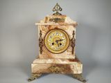 a small clock that is sitting on a table