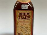 an image of a bottle of rum and bailey rum on a white surface