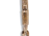 a close up of a wooden object on a white surface
