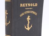 a close up of a book with an anchor on it
