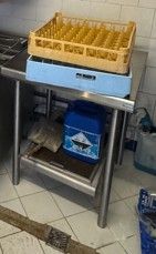 an image of a kitchen with a stove, sink, and dishwasher