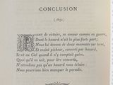 an open book with a black and white image of a poem