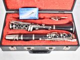 two clarinets in a case on a red cloth